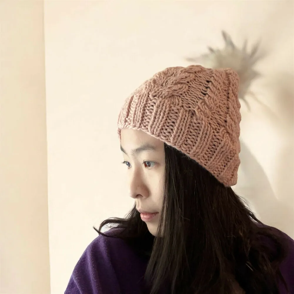Cable Hand Knit Slouchy Beanie in beige pink with white fur pompom